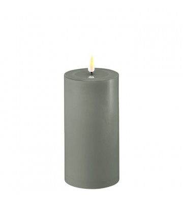 Sage green wax candles with...